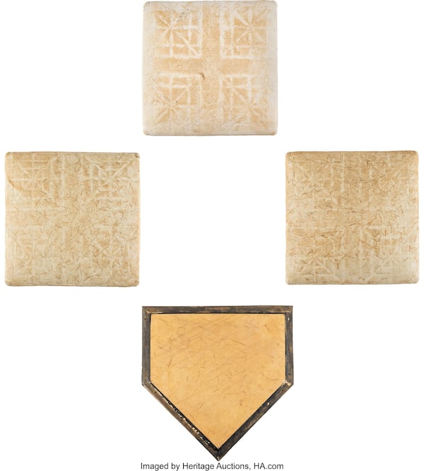 The home plate and bases that Hank Aaron rounded during his historic 715th home run will be auctioned off Aug. 23-25.