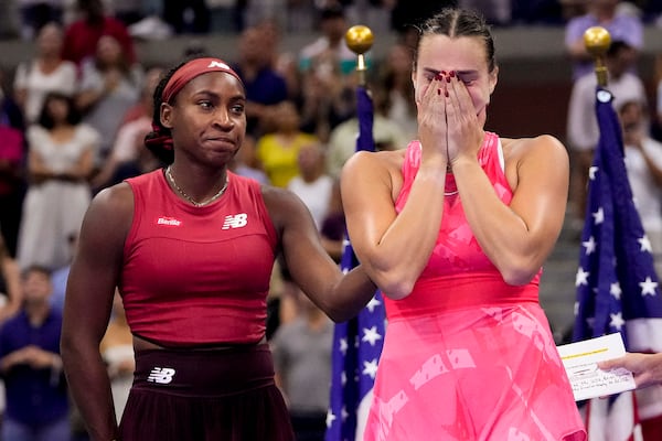 Aryna Sabalenka, of Belarus, right reacts after losing to Coco Gauff, of the United States, left, in the women's singles final of the U.S. Open tennis championships, Saturday, Sept. 9, 2023, in New York. (AP Photo/Frank Franklin II)