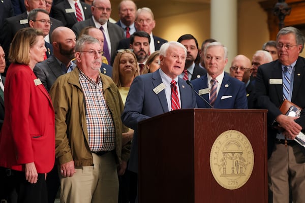 Georgia House Speaker Jon Burns announces school safety legislation on the south wing of the State Capitol on Feb. 3 in Atlanta. Also pictured are the parents of one of the victims of the September Apalachee High School shooting, Richard and Rita Aspinwall. Their son Ricky Aspinwall was a teacher and an assistant football coach at Apalachee High School. (Jason Getz/AJC)