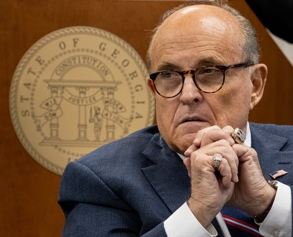 201203-Atlanta- Rudi Giuliani listens to testimony during a subcommittee of the state Senate judiciary committee meeting at the State Capitol on Thursday, Dec. 3, 2020. Giuliani brought fellow lawyers and witnesses who alleged serious voting problems in Georgia and asked that the State Legislature chose GeorgiaÕs electors. Ben Gray for the Atlanta Journal-Constitution