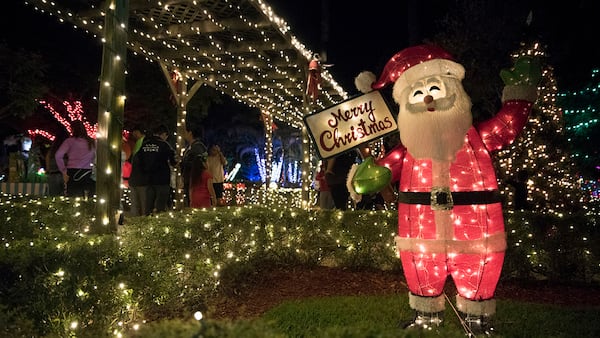 A Santa Claus welcomes visitors to Hoffman's Winter Wonderland in Greenacre. (Andres Leiva / The Palm Beach Post)