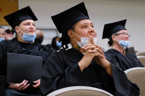 Cassandra Dallas (center), a graduate of the first class of the women’s welding training program at the Newton County Sheriff’s Office, is seen at a ceremony at the facility in Covington on Friday, April 29, 2022. (Arvin Temkar / arvin.temkar@ajc.com)