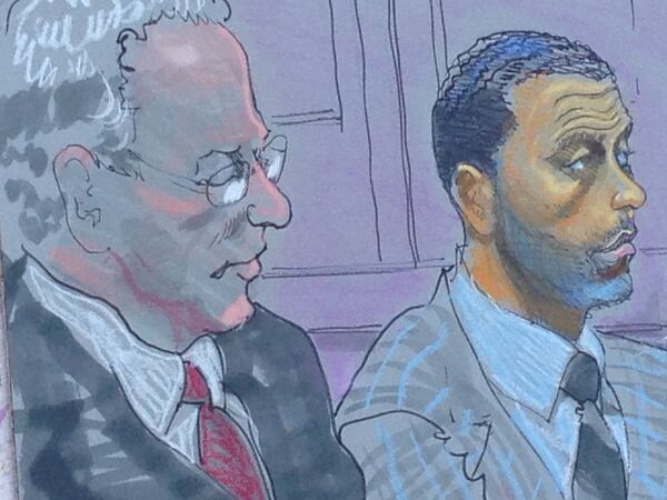 Apollo Nida (right) in a sketch in the courtroom with his attorney Thomas Bever (left).