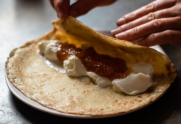 Thin, crepe-like Dutch pancakes are rolled around a mixture of yogurt and marmalade. CONTRIBUTED BY HENRI HOLLIS