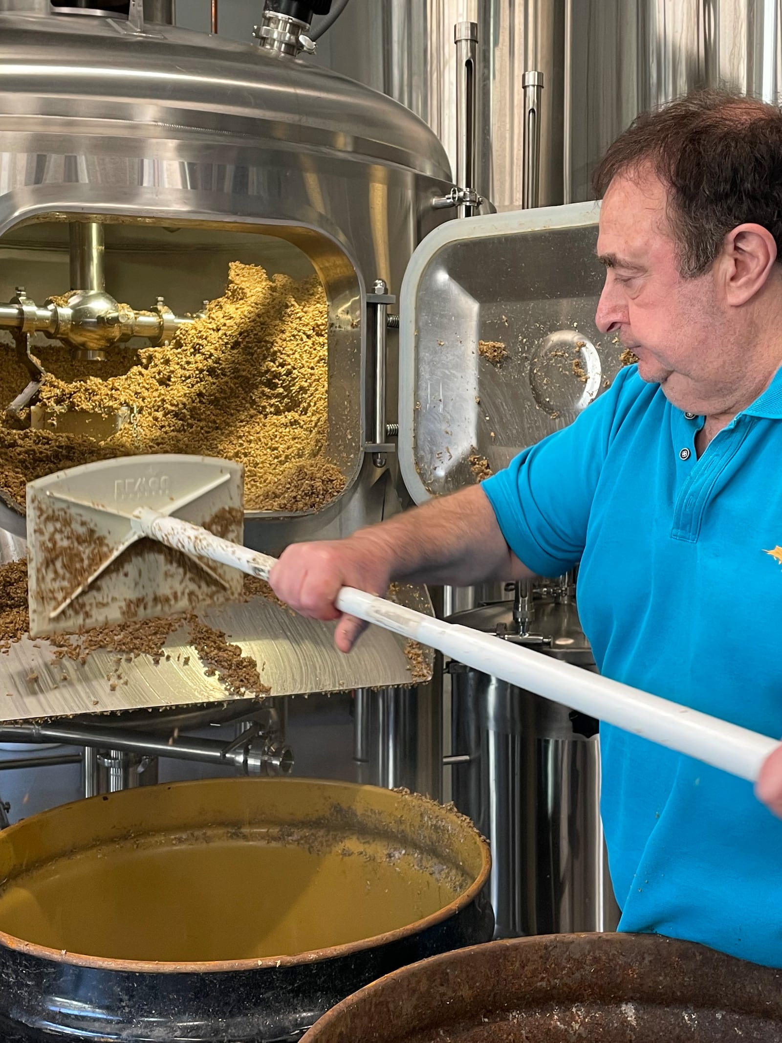 Andy Klubock cleaned out grain at Dr. Scofflaw's at The Works as part of Summits annual "Brewer for a Day" contest. March 2022. 
(Courtesy of Mary Fiorello)