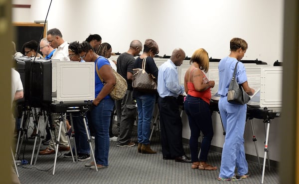 DeKalb County voters line up for early voting at the county Voter Registration and Elections Office in Stone Mountain in October 2016. KENT D. JOHNSON / AJC