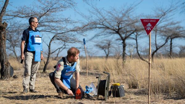 Britain's Prince Harry remotely detonates a landmine at a minefield in Dirico, Angola Friday Sept. 27, 2019, during a visit to see the work of landmine clearance charity the Halo Trust.