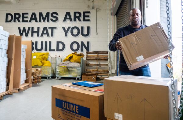 231130 ATLANTA, GA — Saltbox co-founder Maxwell Bonnie accepts shipments from UPS at Saltbox, a co-warehousing, fulfillment and co-working space geared toward e-commerce and small businesses, in Atlanta on Thursday, Nov. 30, 2023.  
Bita Honarvar for The Atlanta Journal-Constitution