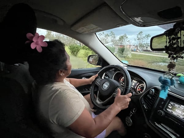 Eduviges drives from her home to the site of a food drive in Lake Park, Georgia on Thursday, November 7, 2024.