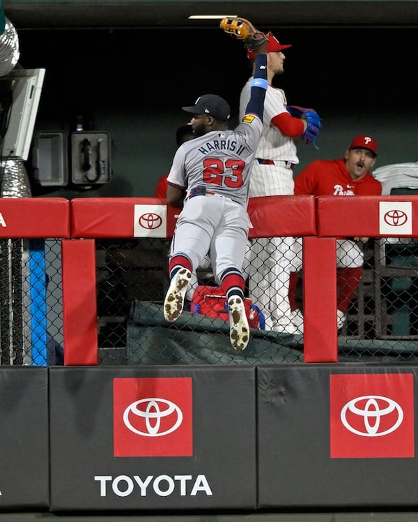 Atlanta Braves outfielder Michael Harris II (23) robs Philadelphia Phillies infielder Austin Hays (9) of a home run during the seventh inning of a MLB game between the Philadelphia Phillies and Atlanta Braves on August 31, 2024, at Citizens Bank Park in Philadelphia, PA. (Photo by Nick Wosika/Icon Sportswire) (Icon Sportswire via AP Images)