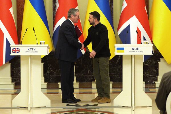 FILE - British Prime Minister Keir Starmer and Ukrainian President Volodymyr Zelensky, right, shake hands ahead of their bilateral talks at Mariinskyi Palace in Kyiv, Ukraine, Thursday, Jan. 16, 2025. (Carl Court, Pool Photo via AP, File)