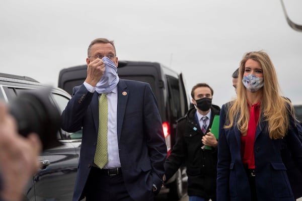 Former Georgia U.S. Rep. Doug Collins and former Georgia U.S. Sen. Kelly Loeffler — both appointed to the Cabinet by President-elect Donald Trump — on the campaign trail in Marietta, Georgia, on Dec. 4, 2020. (Alyssa Pointer/The Atlanta Journal-Constitution/TNS)