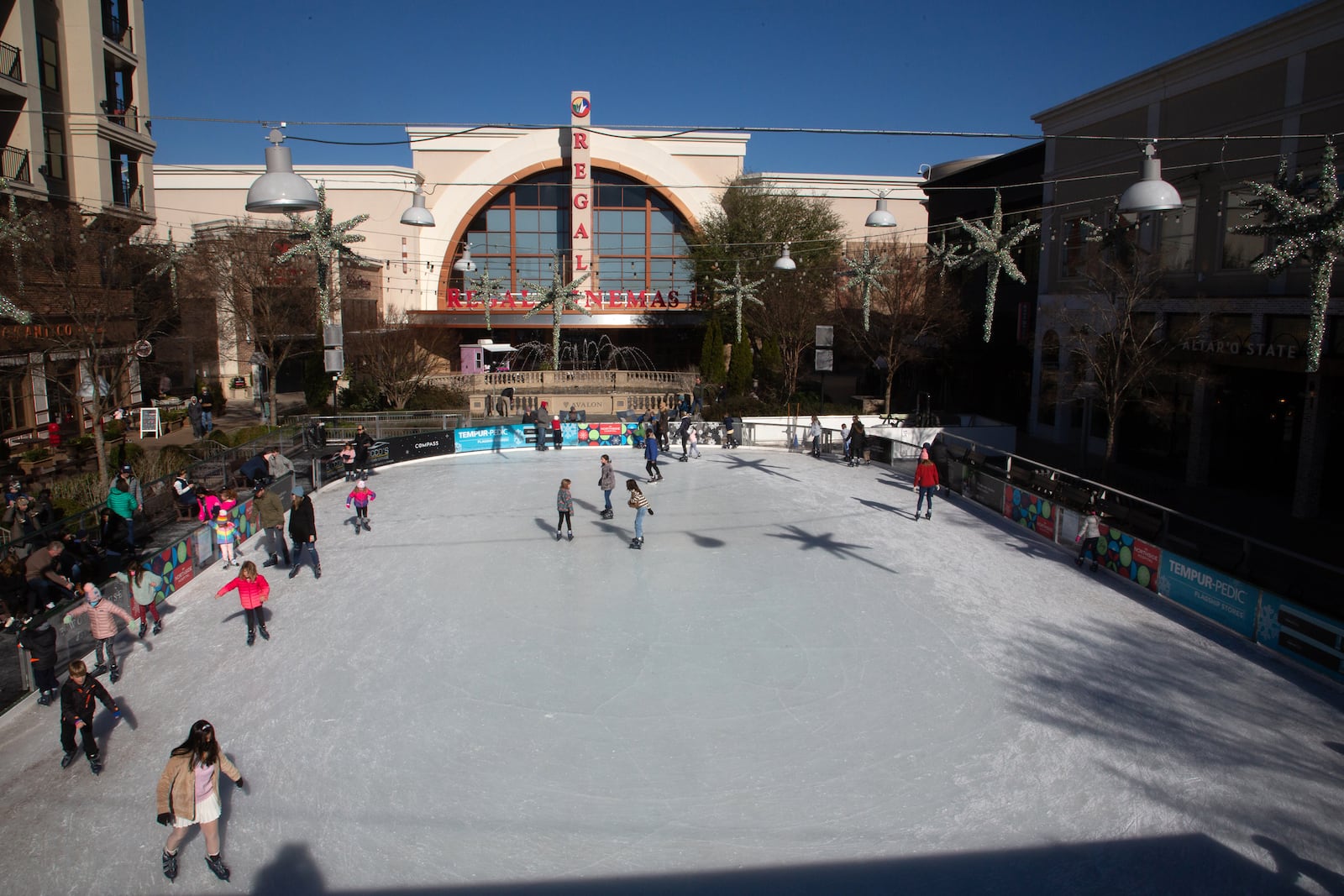 Friends and family skate at the ice-skating rink at Avalon on Ice in Alpharetta on Saturday, January 8, 2022. The rink is open through Jan. 17. STEVE SCHAEFER FOR THE ATLANTA JOURNAL-CONSTITUTION