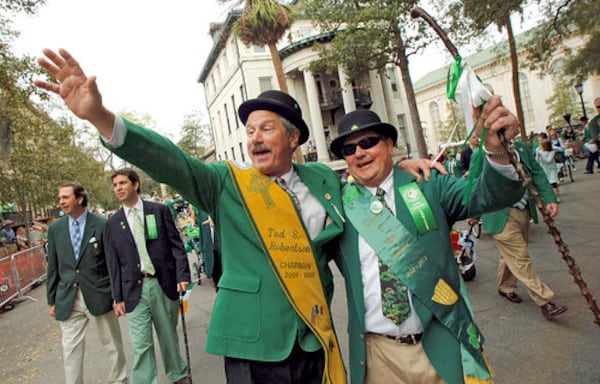 Cousins Danny and Ted Robertson (right) wave to friends while walking in the 2008 parade.