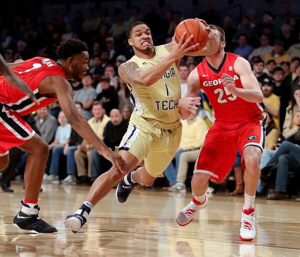 Georgia Tech guard Tadric Jackson (1) drives between Georgia’s Yante Maten (1) and Kenny Paul Geno (25) in the first half of an NCAA college basketball game Tuesday, Dec. 20, 2016, in Atlanta. (AP Photo/John Bazemore)