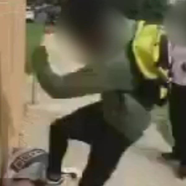 This is a screenshot of cellphone video that appears to show a 15-year-old student kicking a 12-year-old at Lithonia Middle School on Oct. 17. (Photo: Channel 2 Action News)