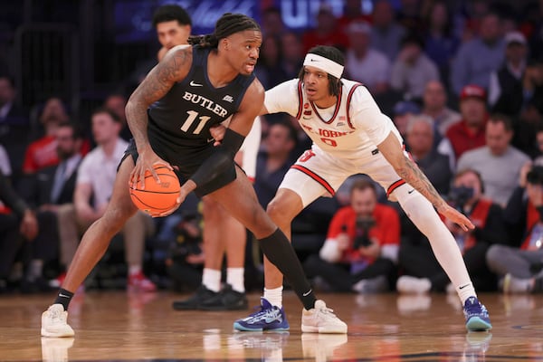 Butler forward Jahmyl Telfort (11) dribbles the ball against St. John's guard Aaron Scott (0) during the first half of an NCAA college basketball game in the quarterfinals of the Big East Conference tournament, Thursday, March 13, 2025, in New York. (AP Photo/Pamela Smith)