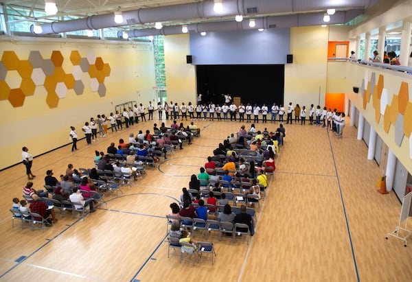 Beecher Hills Elementary school principal Crystal Jones introduces the teachers and staff to the parents in the newly constructed gym during the first open house after the schools’ extensive renovation Friday, August 9, 2019. STEVE SCHAEFER / SPECIAL TO THE AJC