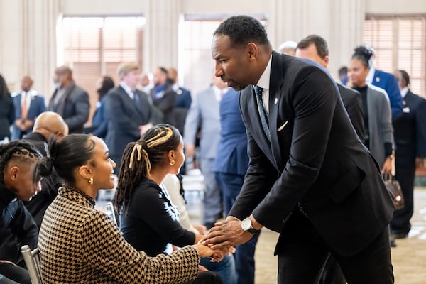 250103 ATLANTA, GA — Atlanta Mayor Andre Dickens greets Clara Faith, daughter of Georgia State Sen. Vincent Fort, after a brief service as Fort lies in state in the old council chambers at Atlanta City Hall on Friday, Jan. 3, 2025. Fort died from complications from cancer in December at 68 years old.
(Bita Honarvar for The Atlanta Journal-Constitution)