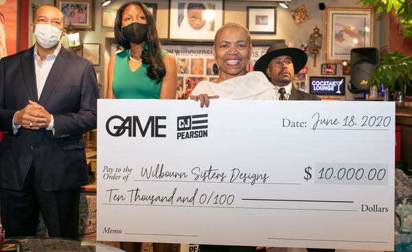 Janice Wilbourn accepts a $10,000 donation from the GAME Relief Fund. CONTRIBUTED