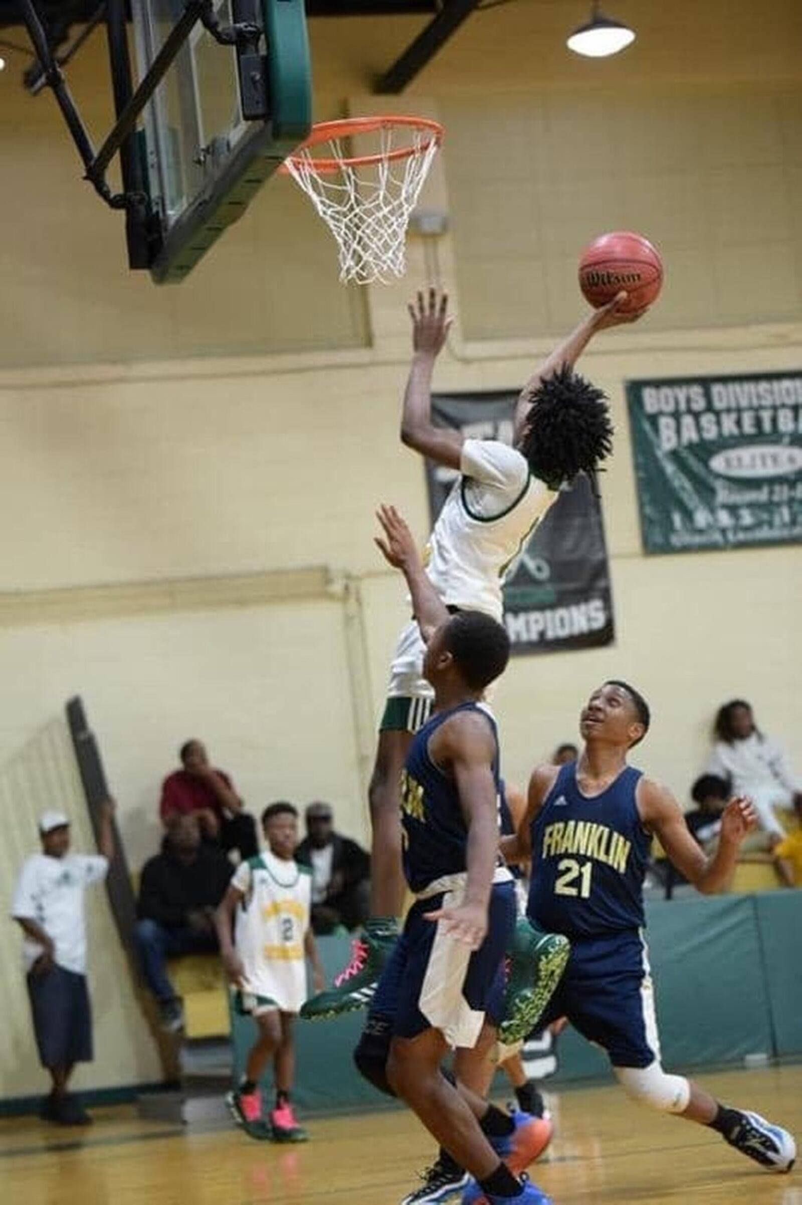 AJC columnist Gracie Bonds Staples’ grandnephew Jaylin Nunnery, in the white jersey, dreams of going to college and playing in the NBA. A recent NCAA decision could impact his life. CONTRIBUTED