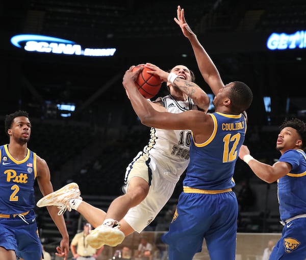 021421 Atlanta: Georgia Tech guard Jose Alvarado is fouled driving to the basket by Pittsburgh forward Abdoul Karim Coulibaly in an NCAA college basketball game on Sunday, Feb 14, 2021, in Atlanta.      Curtis Compton / Curtis.Compton@ajc.com”