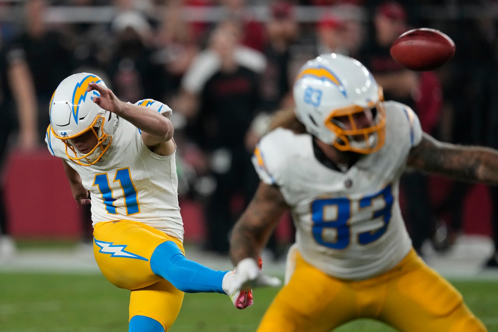 Los Angeles Chargers place kicker Cameron Dicker (11) kicks a 50-yard field goal during the first half of an NFL football game against the Arizona Cardinals, Monday, Oct. 21, 2024, in Glendale Ariz. (AP Photo/Matt York)