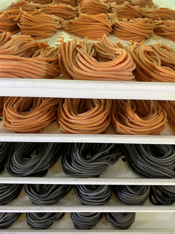 Pasta Mami’s rolled pastas include tomato bucatini (top) and squid ink bucatini (bottom). Courtesy of Angela Portwood