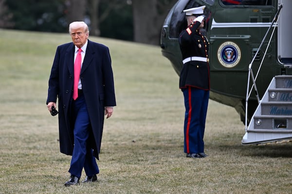 President Donald Trump walks from Marine One as he arrives on the South Lawn of the White House after speaking at the Conservative Political Action Conference, CPAC, Saturday, Feb. 22, 2025, in Washington. (AP Photo/John McDonnell)