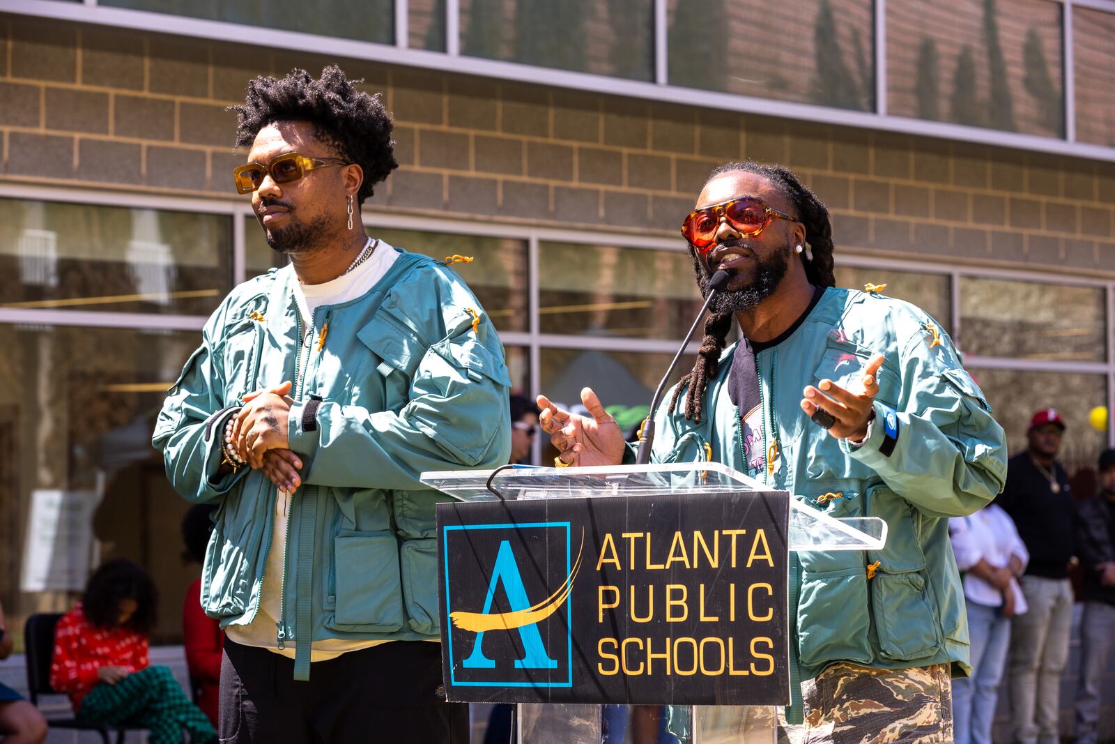 WowGr8 aka Doctur Dot and Olu aka Johnny Venus speak to unveil a new community garden at Jean Childs Young Middle School in Atlanta on Thursday, March 30, 2023. Olu and WowGr8 of hip-hop group EARTHGANG helped sponsor the project.  They dropped their latest album "Perfect Fantasy" on Oct. 29, 2024. (Arvin Temkar / arvin.temkar@ajc.com)