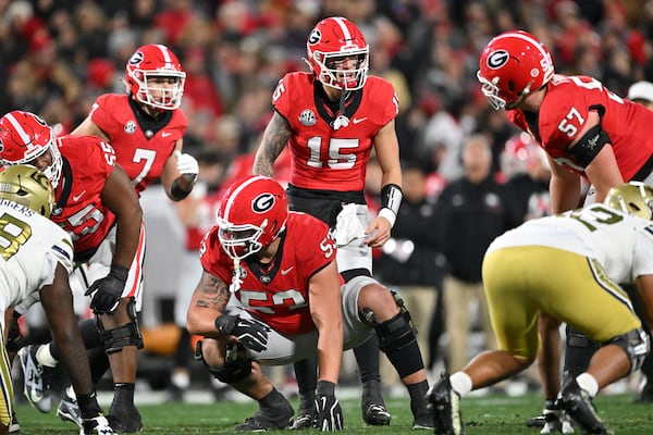 Georgia quarterback Carson Beck (15) shouts instructions  during the first half in an NCAA football game at Sanford Stadium, Friday, November 29, 2024, in Athens. (Hyosub Shin / AJC)