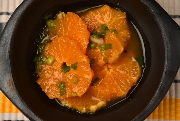 "It’s so simple and it’s so good,” chef Christian Lopez says of Chuyaco (navel orange salad). It's perfect for a first course. (Styling by Christian Lopez / Chris Hunt for the AJC)