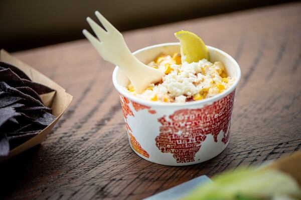 Elote corn side with queso listo, Valentina, crema, queso fresco, and lime. Photo credit- Mia Yakel.