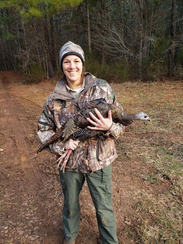 Georgia Department of Natural Resources wildlife biologist Emily Rushton with a turkey hen. (Photo courtesy of Emily Rushton)