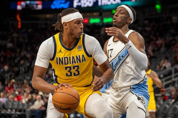 Indiana Pacers center Myles Turner (33) moves the ball during the first half of an NBA basketball game between the Atlanta Hawks, Saturday, Mar. 8, 2025, in Atlanta. (AP Photo/Erik Rank)