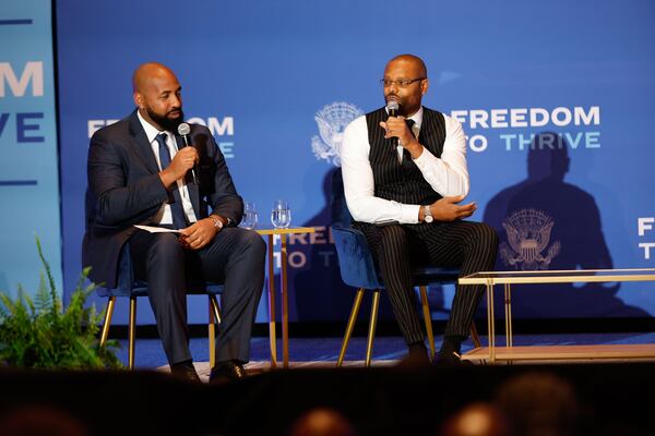 Earn Your Leisure podcast creators Troy Millings and Rashad Bilal speak to Vice President Kamala Harris during an event at the Georgia International Convention Center to kick off her economic tour focusing on improving opportunities for Black men on Monday, April 29, 2024. (Natrice Miller/AJC)