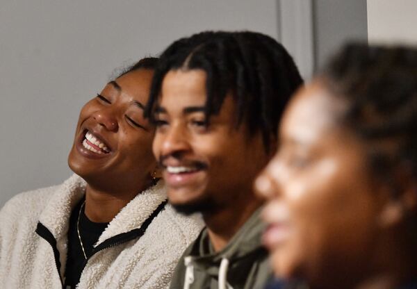 Teachers (from left) Myielle Kimbrough-Meyer, Alvin Glymph and Melanie Lange react as they watch a sitcom “Abbott Elementary” at the home of Melanie Lange, Friday, Jan. 20, 2023, in College Park. Melanie Lange is holding a viewing party for "Abbott Elementary," a sitcom about a Philadelphia school. The popular show is a particular hit with educators, who see themselves and colleagues in the over-the-top antics of the sitcom's characters. (Hyosub Shin / Hyosub.Shin@ajc.com)