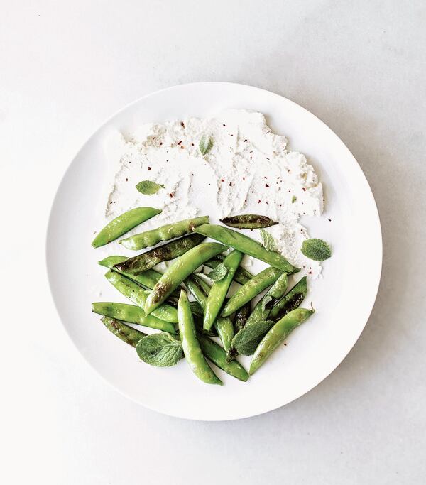 Charred Snap Peas with Chive Vinaigrette and Whipped Ricotta from “The Vegetable Gardener’s Cookbook” by Danielle Majeika (Page Street Publishing, $21.99). 