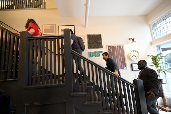 Attendees tour inside The Sylvan Building on 233 Mitchell St SW during walking tour of South Downtown lead by Jon Birdsong and April Stammel, Tuesday, Mar. 12, 2024, in Atlanta. (Hyosub Shin / Hyosub.Shin@ajc.com)