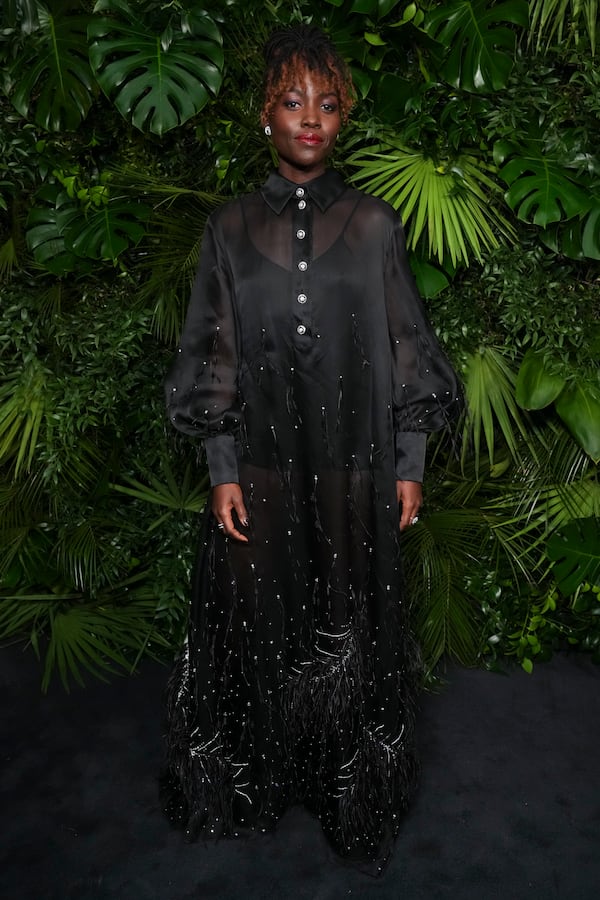 Lupita Nyong'o arrives at Chanel's 16th Annual Pre-Oscar Awards Dinner on Saturday, March 1, 2025, at The Beverly Hills Hotel in Beverly Hills, Calif. (Photo by Jordan Strauss/Invision/AP)