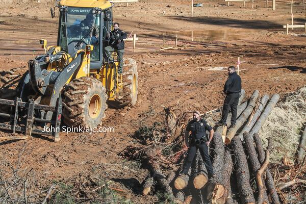 Police are using construction vehicles to access areas of the site that are difficult to reach by foot.