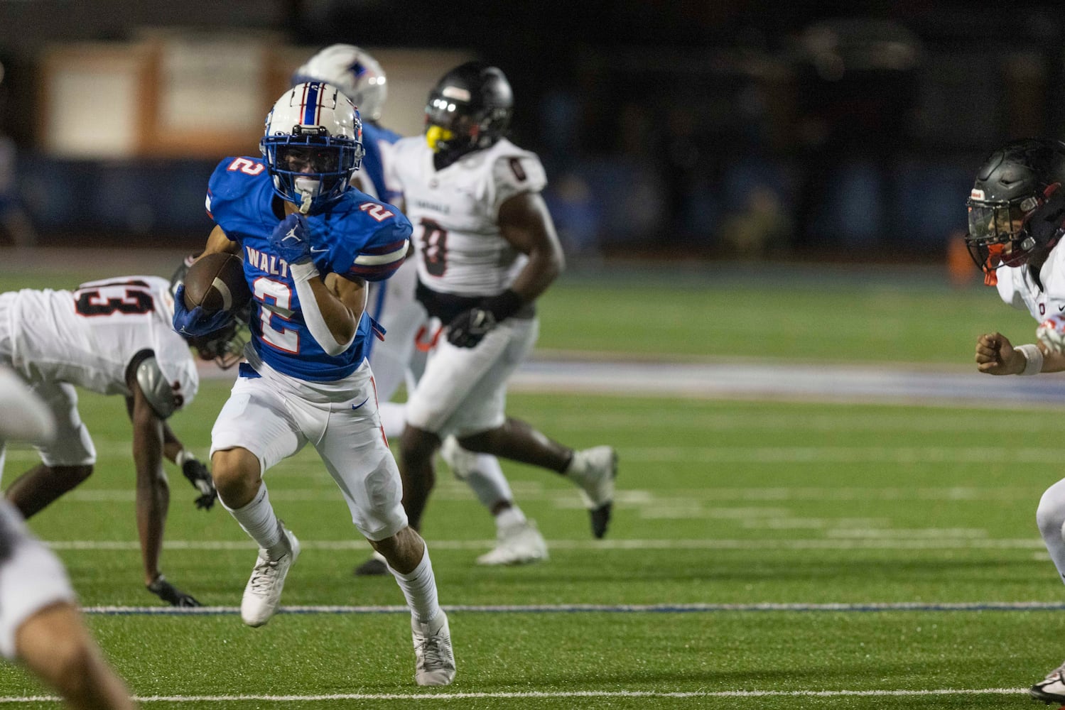 Walton’s Austin Williams (2) runs the ball during a game against Osborne Friday night. (Photo/Jenn Finch)