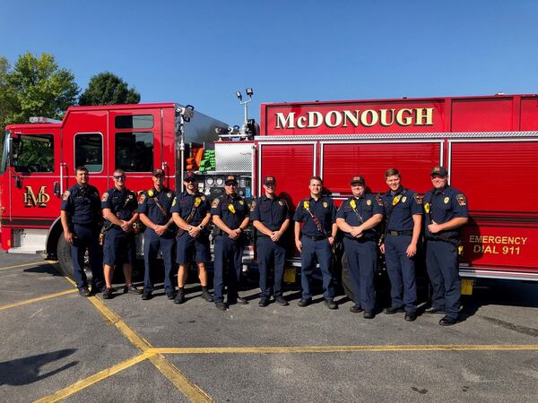 Crew members with the McDonough Fire Department pose with a local fire engine. (Courtesy of McDonough Fire Department)