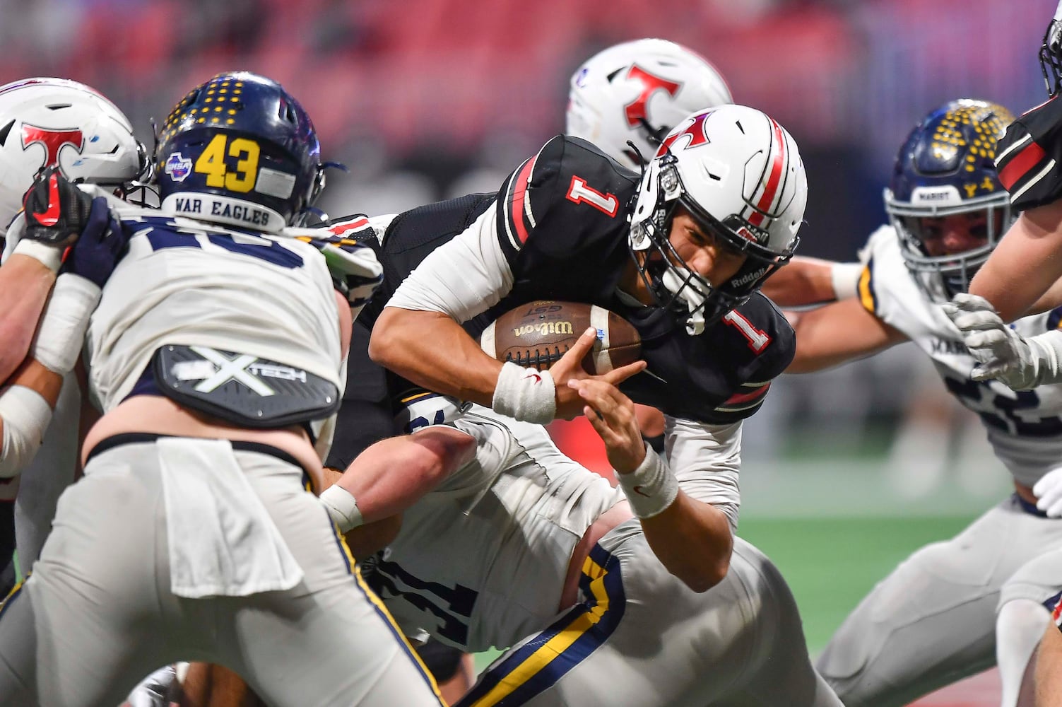 North Oconee’s quarterback Harrison Faulkner (1) dives through Marist’s defense during the second half of a Class 4A championship game at the Mercedes-Benz Stadium Monday, Dec. 16, 2024. (Photo/Daniel Varnado)