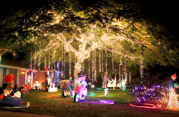 Christmas lights are glowing in the Gabriel street neighborhood in Lake Clark Shores. (Bill Ingram/Palm Beach Post)