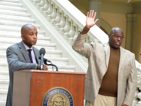 Jarrod Huey (left) with his friend Jamie Dukes at the Georgia State Capitol. CREDIT: Rodney Ho/ rho@ajc.com