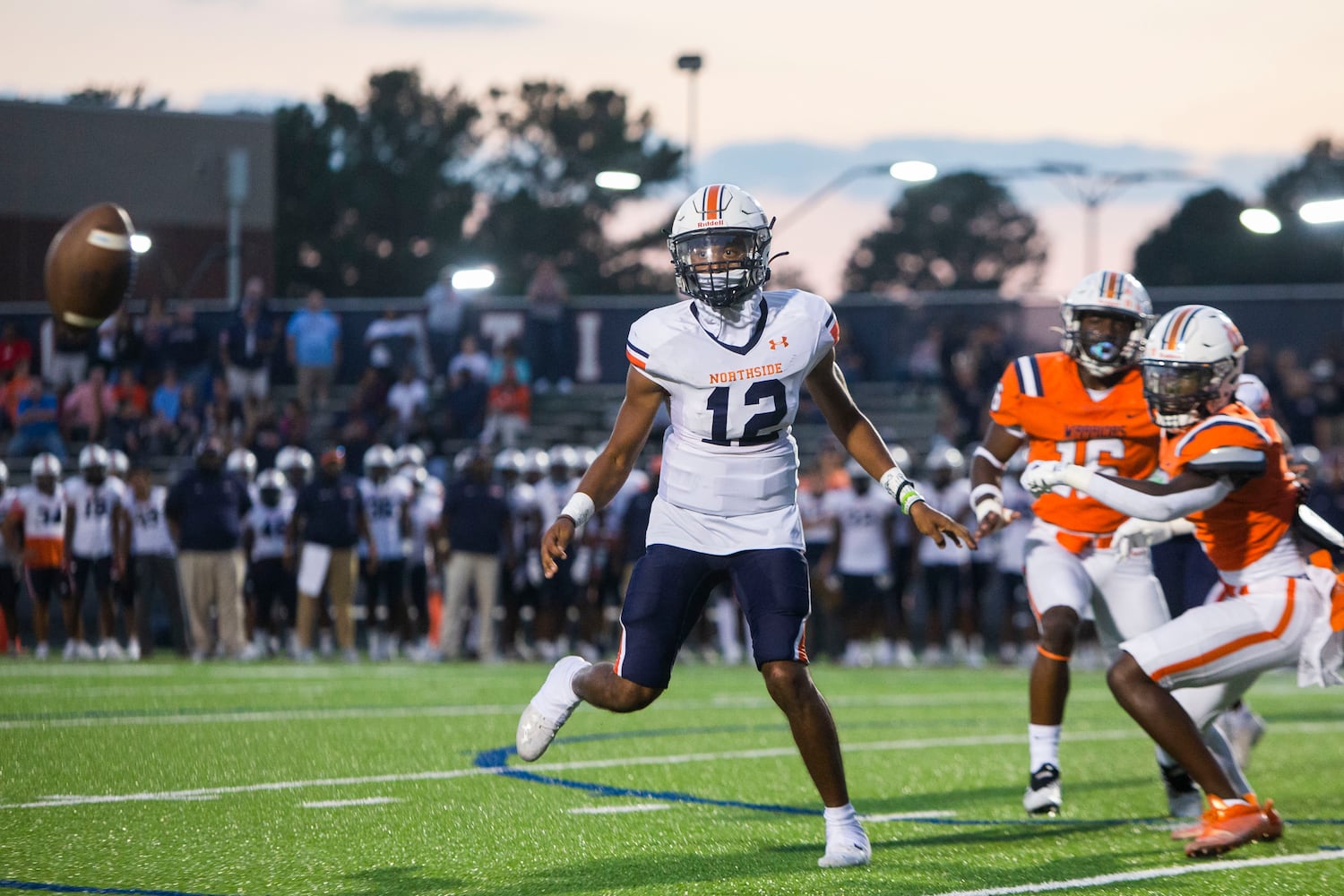 Damien Dee, quarterback for Northside, laterally passes the ball during the North Cobb vs. Northside high school football game on Friday, September 16, 2022, in Kennesaw, Georgia. North Cobb led Northside 14-7 at the half. CHRISTINA MATACOTTA FOR THE ATLANTA JOURNAL-CONSTITUTION.