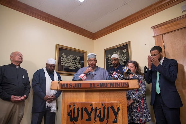  Imam Furqan Muhammad leads a prayer following a press conference at the Masjid Al-Mu'minun mosque in Atlanta's Peoplestown neighborhood, Friday, March 15, 2019. The press conference was called as a result of the mass shooting that killed 49 people worshipping at a mosque in New Zealand. Members of local metro Atlanta mosques and other faith organizations came to together to condemn the actions of the shooter and encourage other houses of worship to instate more security. 