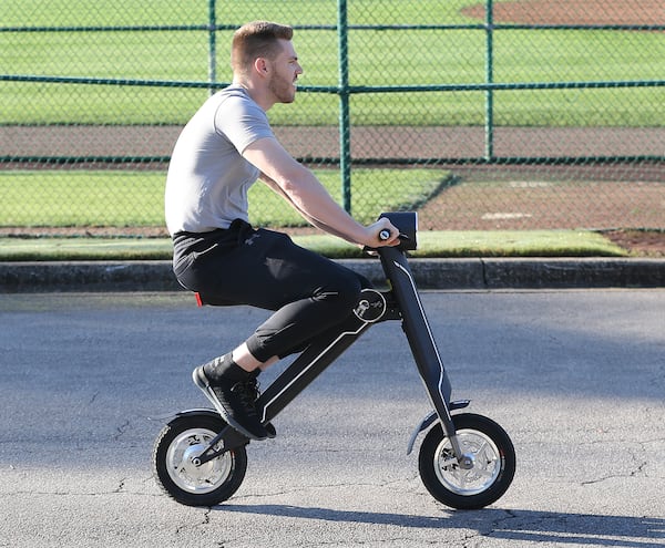 Feb 16, 2018 Lake Buena Vista: Atlanta Braves first baseman Freddie Freeman reports early for spring training arriving on a scooter on Friday, Feb 16, 2018, at the ESPN Wide World of Sports Complex in Lake Buena Vista.     Curtis Compton/ccompton@ajc.com