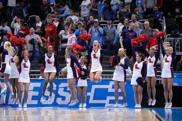 Mississippi cheerleaders react after Mississippi defeated North Carolina in the first round of the NCAA college basketball tournament, Friday, March 21, 2025, in Milwaukee. (AP Photo/Kayla Wolf)